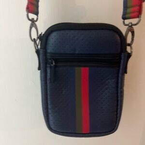 HAUTE SHORE Stylish Blue Neoprene Crossbody Bag with Red and Green Accents